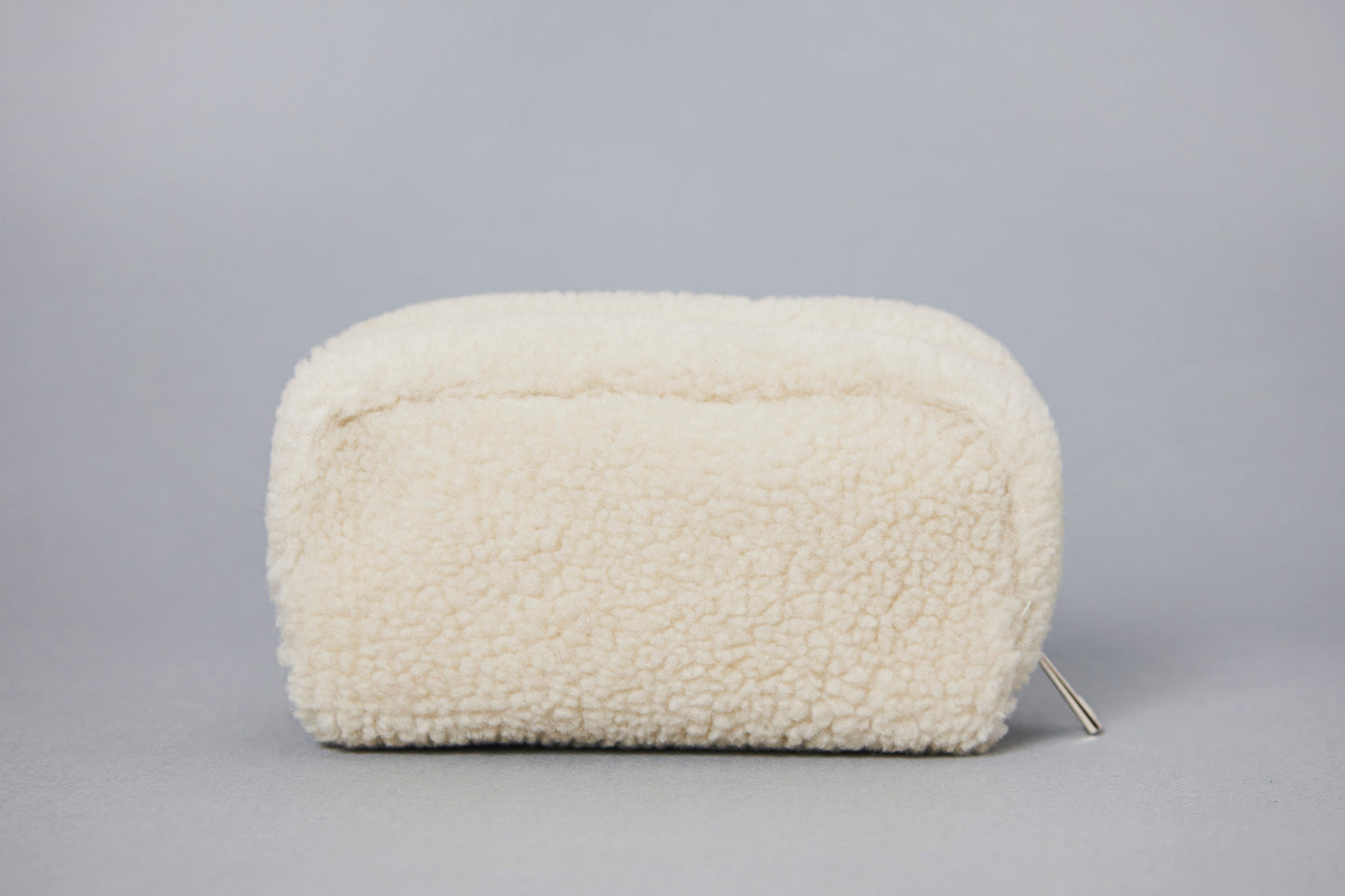 ivory shearling pouch